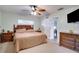 Neutral bedroom with natural lighting and classic ceiling fan at 6513 14Th W Ave, Bradenton, FL 34209