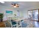 Charming dining room with modern light fixture and hardwood floors at 6513 14Th W Ave, Bradenton, FL 34209