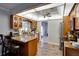 Kitchen with stainless appliances, granite countertops, and wood floors at 6513 14Th W Ave, Bradenton, FL 34209