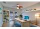 Bright home office with built-in shelving and French doors leading to the outdoor space at 6513 14Th W Ave, Bradenton, FL 34209