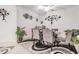 Bright dining room features modern decor, a glass table, and unique ceiling fan at 6748 Ripple Pond Loop, Zephyrhills, FL 33541