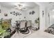 Well-lit dining room features modern decor, a glass table, and a decorative rug at 6748 Ripple Pond Loop, Zephyrhills, FL 33541