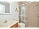 This bathroom features a tile shower, modern sink, and vanity with a mirror, offering a clean and functional space at 7051 Derwent Glen Cir, Land O Lakes, FL 34637