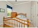 Bedroom featuring a wood-frame bed, neutral paint, window with blind, and door to a closet at 7051 Derwent Glen Cir, Land O Lakes, FL 34637