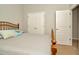 Bedroom showcases wood trim, neutral paint, carpet, a large double door closet, and ensuite access at 7051 Derwent Glen Cir, Land O Lakes, FL 34637