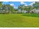 Scenic view of a well-maintained community park with a playground and soccer field on a bright day at 7051 Derwent Glen Cir, Land O Lakes, FL 34637