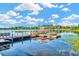 Beautiful lake view with a wooden dock and seating area, perfect for enjoying waterfront living at 7051 Derwent Glen Cir, Land O Lakes, FL 34637
