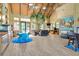 Inviting lounge area with a cozy seating arrangement, area, and large windows for natural light at 7051 Derwent Glen Cir, Land O Lakes, FL 34637