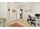 Office with a desk, chair, and sofa, neutral paint, and tile flooring at 7051 Derwent Glen Cir, Land O Lakes, FL 34637