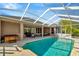 Screened-in pool with a spacious patio area for dining and relaxing, great for outdoor entertainment at 7051 Derwent Glen Cir, Land O Lakes, FL 34637