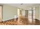 Bright bedroom offers hardwood floors, with ensuite bath and large mirrored closet at 7509 Rocky Point Dr, Hudson, FL 34667