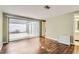 Bright bedroom features hardwood floors and sliding door access to a private lanai at 7509 Rocky Point Dr, Hudson, FL 34667