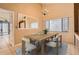 Dining room with modern table set, area rug, and chandelier lighting at 7509 Rocky Point Dr, Hudson, FL 34667
