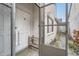 Home's front entrance with a screen door leading to a stone tile walkway at 7509 Rocky Point Dr, Hudson, FL 34667
