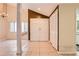 Bright foyer with tile flooring, closet and chandelier at 7509 Rocky Point Dr, Hudson, FL 34667