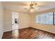Comfortable living room with hardwood floors and bright window at 7509 Rocky Point Dr, Hudson, FL 34667