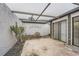 Covered lanai features privacy wall with room for outdoor dining at 7509 Rocky Point Dr, Hudson, FL 34667