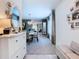 Bright foyer with a console table, decorative mirror, and views of the dining room and living room at 7737 Sail Clover Ln, Zephyrhills, FL 33540