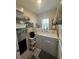 Functional laundry room with a washer, dryer, and ample storage space at 7737 Sail Clover Ln, Zephyrhills, FL 33540