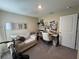 Comfortable home office with a desk, seating, and a sofa for relaxation at 7737 Sail Clover Ln, Zephyrhills, FL 33540