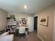 Functional home office featuring a desk, shelving, and comfortable seating at 7737 Sail Clover Ln, Zephyrhills, FL 33540