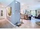 Bright, open-concept living space showcasing stylish tile flooring and an integrated kitchen and living area at 7737 Sail Clover Ln, Zephyrhills, FL 33540
