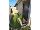 Functional side yard with a garden, ideal for herbs or vegetables, featuring privacy fencing and good drainage at 7737 Sail Clover Ln, Zephyrhills, FL 33540