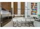 Modern kitchen with stainless steel refrigerator, island with seating and open floorplan at 88 Avonwood, Tampa, FL 33625
