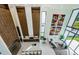 Open-concept living area with floor-to-ceiling windows and modern decor at 88 Avonwood, Tampa, FL 33625
