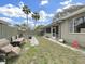 Backyard with a patio, a brick barbeque grill, and ample seating for outdoor entertainment at 101 Gulf Blvd, Belleair Beach, FL 33786