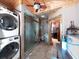 Bathroom with a glass shower and laundry area at 101 Gulf Blvd, Belleair Beach, FL 33786