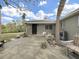 Inviting entryway featuring a secure metal gate, lovely plants, and comfortable seating at 101 Gulf Blvd, Belleair Beach, FL 33786