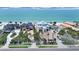 Exterior view of beachfront houses with landscaped yards at 101 Gulf Blvd, Belleair Beach, FL 33786