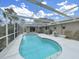 Enclosed pool and patio area with a view of the home's exterior at 101 Gulf Blvd, Belleair Beach, FL 33786