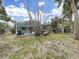 Backyard featuring a screened pool area, perfect for relaxation and outdoor enjoyment at 101 Gulf Blvd, Belleair Beach, FL 33786