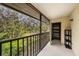 A tranquil balcony view overlooking lush greenery and offering fresh air, plus a storage closet at 110 Hammock Pine Blvd # 110, Clearwater, FL 33761