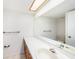 Simple bathroom with a large mirror, white countertop, and essential fixtures, providing a practical space at 110 Hammock Pine Blvd # 110, Clearwater, FL 33761