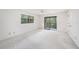 Spacious bedroom with neutral walls, ample natural light, and balcony access, offering a serene atmosphere at 110 Hammock Pine Blvd # 110, Clearwater, FL 33761