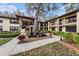 Charming multi-story condo building with beautiful landscaping, creating an inviting atmosphere for residents at 110 Hammock Pine Blvd # 110, Clearwater, FL 33761