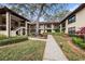 Well-maintained condo building with central courtyard and lush landscaping, offering a serene residential environment at 110 Hammock Pine Blvd # 110, Clearwater, FL 33761