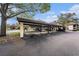Designated covered parking area providing protection from the elements for residents' vehicles at 110 Hammock Pine Blvd # 110, Clearwater, FL 33761