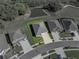 Aerial shot of property highlighting landscaping and location within a residential neighborhood at 11465 June Briar Loop, San Antonio, FL 33576