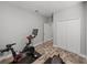 Clean exercise room featuring a modern stationary bike and workout bench, creating a private fitness space at 11465 June Briar Loop, San Antonio, FL 33576