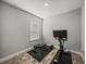 Bright exercise room with workout bench, weights, and modern stationary bike for a complete fitness experience at 11465 June Briar Loop, San Antonio, FL 33576