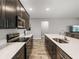 Modern kitchen with stainless steel appliances, ample countertop space and convenient breakfast bar seating at 11465 June Briar Loop, San Antonio, FL 33576