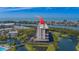 An aerial view shows the property with beautiful waterfront views, a swimming pool, and well-maintained landscaping at 11590 Shipwatch Dr # 342, Largo, FL 33774