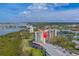 A waterfront condo complex surrounded by lush greenery and a tranquil lake at 11590 Shipwatch Dr # 342, Largo, FL 33774