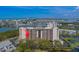 An aerial view showcases the building's location with water views, surrounded by lush greenery at 11590 Shipwatch Dr # 342, Largo, FL 33774