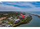 A waterfront condo complex surrounded by lush greenery, a tranquil lake, beaches and boat docks at 11590 Shipwatch Dr # 342, Largo, FL 33774