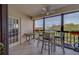 A bright balcony features a seating area with views of the cityscape and surrounding greenery at 11590 Shipwatch Dr # 342, Largo, FL 33774